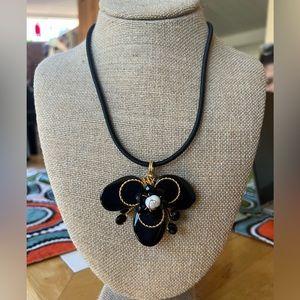 Fashion necklace.  Black & gold embellishment.